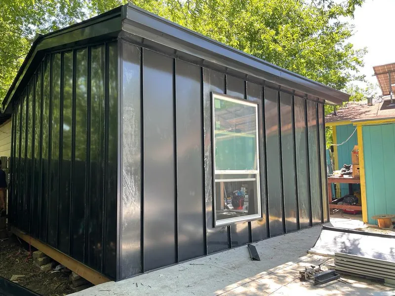 Black standing seam metal wall panels for Metal Roof Installation in Volo